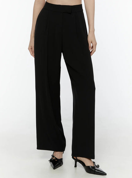 Mid-Rise Tailored Pants IL506 Black three-quarter front view on model from waist down highlighting pleated front high rise waistband and wide-leg cut with black bow slingback heels