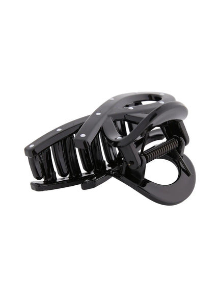 Mini Dot Hair Pin IL514 Black low angle detail showing claw teeth grip and spring hinge with white dot pattern on glossy resin