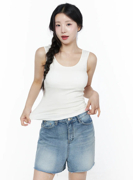 LEWKIN Minimalist Slim-Fit Tank Top IU525 White S/M front view on model with braided hair, fitted scoop neck ribbed tank top styled with denim shorts