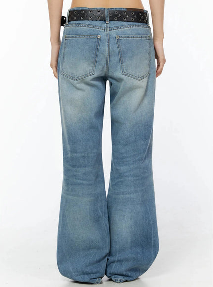 Miri Low Rise Straight Jeans IL509 Blue back view on model showing wide flared leg washed denim fade two back pockets and black star belt