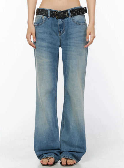 Miri Low Rise Straight Jeans IL509 Blue front view on model showing low-rise waistband washed blue denim wide-leg silhouette and black star belt