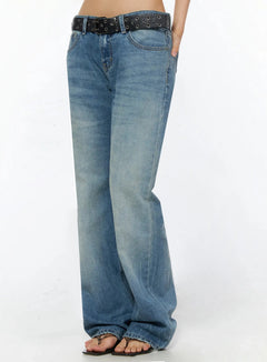 LEWKIN Miri Low Rise Straight Jeans IL509 Blue size S side view on model showing washed denim flare hem and black studded star belt