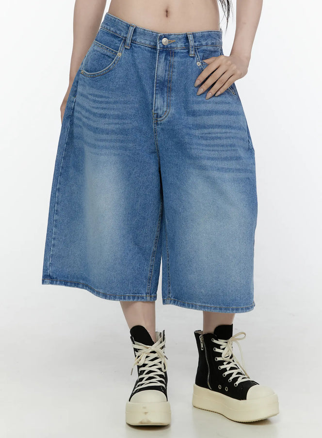 LEWKIN Miu Wide Leg Jeans IL521 Blue front close-up shot on model size S showing washed denim wide-leg silhouette waistband button and front pockets styled with platform sneakers