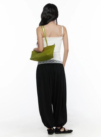 Multi-Purpose Balloon Sweatpants CL513 Black back shot on model in white lace-trim cami with green bag showing full-length back silhouette