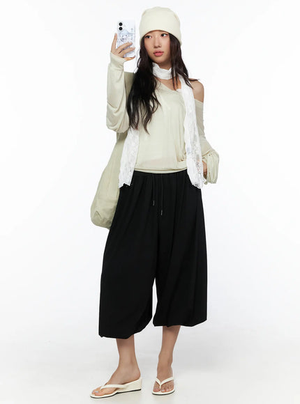 LEWKIN Multi-Purpose Balloon Sweatpants CL513 Black full-length front shot on model wearing beanie and lace scarf styled with sandals