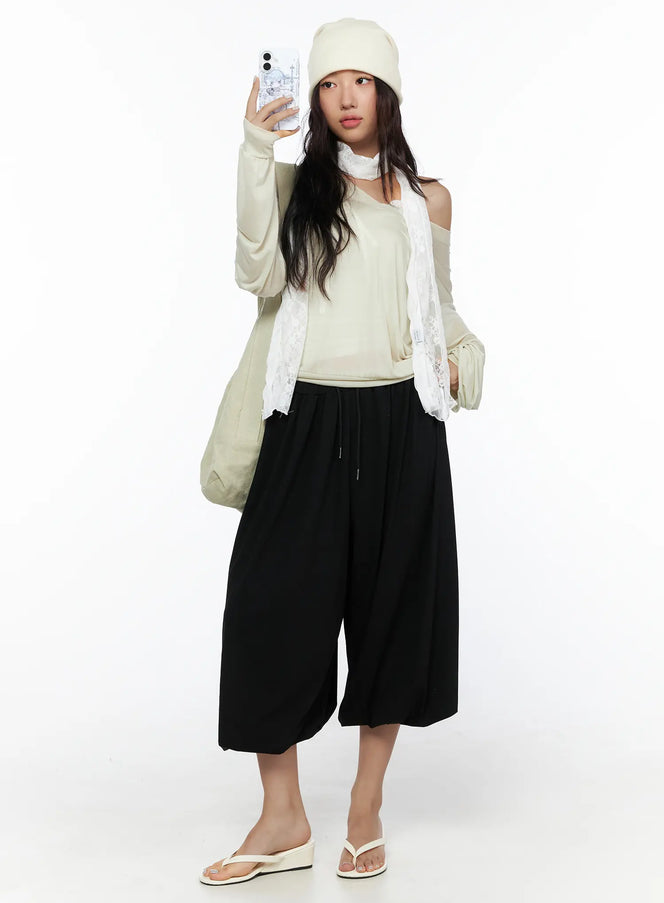 LEWKIN Multi-Purpose Balloon Sweatpants CL513 Black full-length front shot on model wearing beanie and lace scarf styled with sandals