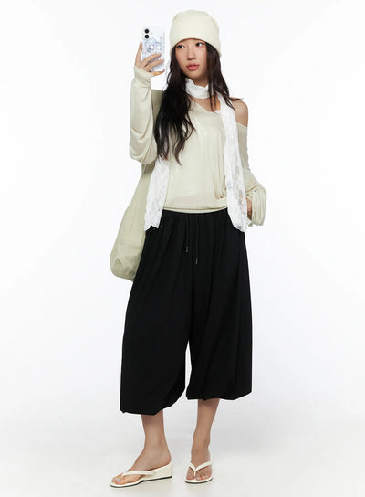 LEWKIN Multi-Purpose Balloon Sweatpants CL513 Black full-length front shot on model wearing beanie and lace scarf styled with sandals