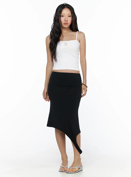 Multifunctional Ruched Sleeveless Top CL513 White full-length front shot on model in black asymmetric midi skirt and white cami top with chain necklace and silver wedge sandals