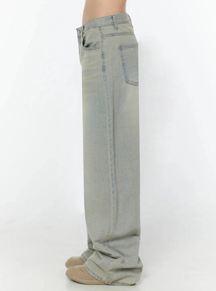 Naia Washed Baggy Jeans IU524 Light blue back crop shot on model showing two large back pockets, center seam, waistband detail, and light acid wash texture