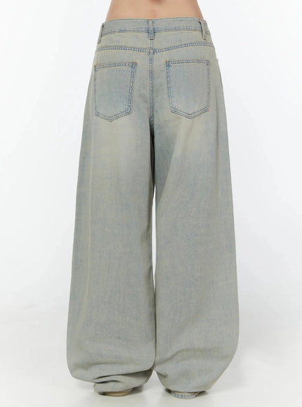 Naia Washed Baggy Jeans IU524 Light blue back close-up detail showing two stitched back pockets, waistband, belt loops, and vintage blue-tone washed denim fabric