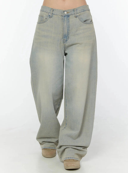 Naia Washed Baggy Jeans IU524 Light blue front crop shot on model showing low-rise fit, front pockets, and extremely wide balloon leg with faded wash