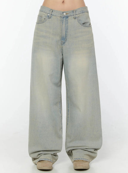LEWKIN Naia Washed Baggy Jeans IU524 Light blue front crop shot on model showing low-rise waistband, silver button, and oversized wide-leg silhouette with vintage wash