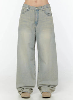LEWKIN Naia Washed Baggy Jeans IU524 Light blue front crop shot on model showing low-rise waistband, silver button, and oversized wide-leg silhouette with vintage wash