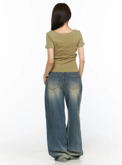 Nayela Vintage Wide Leg Jeans CL517 Blue back shot on model in olive tee showing back pockets and faded denim with wide leg hem