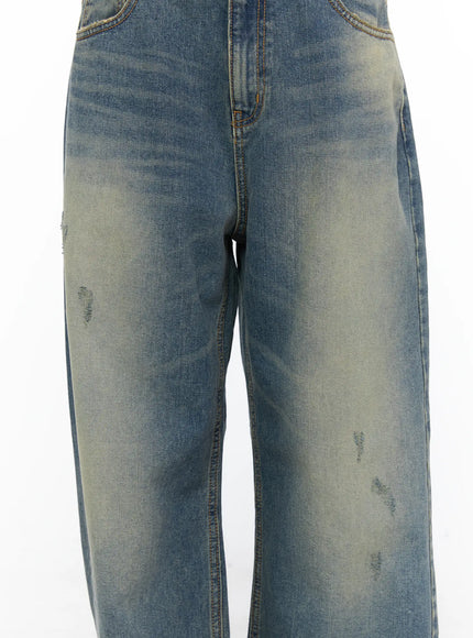 Nayela Vintage Wide Leg Jeans CL517 Blue close-up detail shot showing distressed abrasions yellow fading and wide leg denim texture