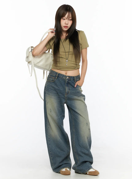 LEWKIN Nayela Vintage Wide Leg Jeans CL517 Blue Size S front shot on model styled with olive crop top and white bag standing pose