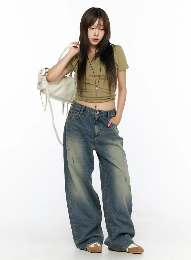 LEWKIN Nayela Vintage Wide Leg Jeans CL517 Blue Size S front shot on model styled with olive crop top and white bag standing pose
