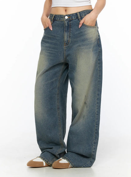 Nayela Vintage Wide Leg Jeans CL517 Blue front shot on model hands in pockets showing low rise waistband and baggy wide leg fit