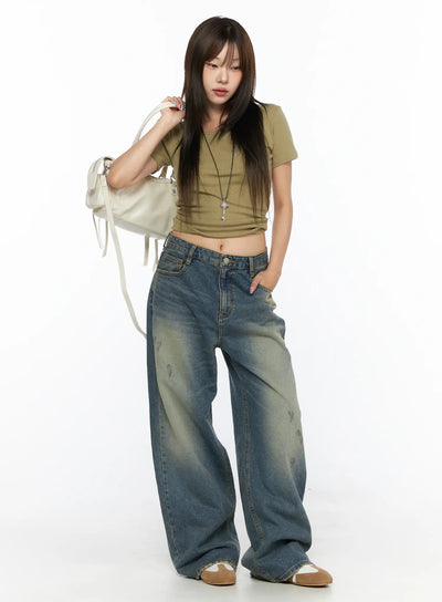 LEWKIN Nayela Vintage Wide Leg Jeans CL517 Blue Size S front shot on model styled with olive crop top and white bag standing pose