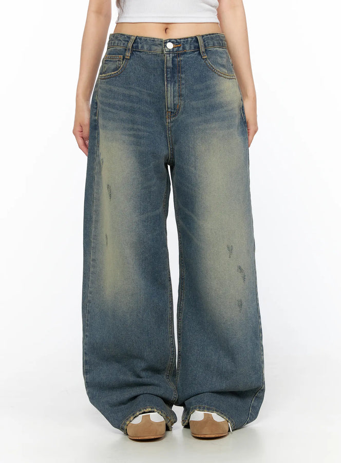 Nayela Vintage Wide Leg Jeans CL517 Blue front close-up shot on model showing waistband button fly and distressed washed denim texture