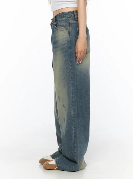 Nayela Vintage Wide Leg Jeans CL517 Blue side shot on model showing wide leg silhouette and faded wash detail with distressing