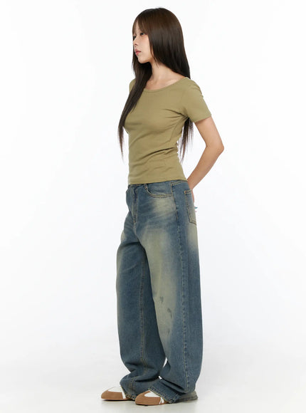 Nayela Vintage Wide Leg Jeans CL517 Blue side shot on model in olive ribbed top showing wide leg silhouette and vintage wash