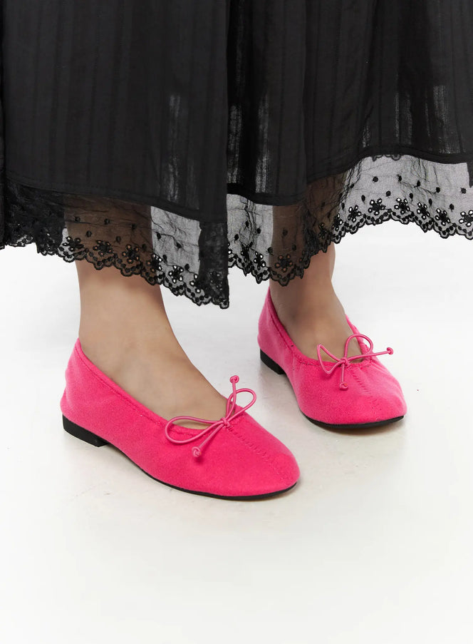 LEWKIN Neon Flats CL510 Pink size 230/US6 side close-up on model wearing black lace-hem maxi skirt, textile upper with bow detail