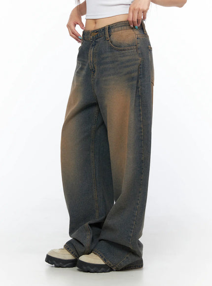 Neya Dark Washed Baggy Jeans CL517 Dark blue side shot on model waist-down highlighting brown gradient wash wide-leg fit and front pocket detail