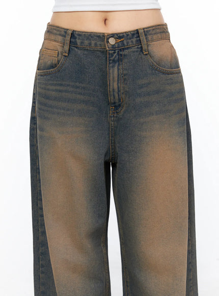 Neya Dark Washed Baggy Jeans CL517 Dark blue close-up front detail shot showing waistband button fly front pockets and brown sun-faded denim texture