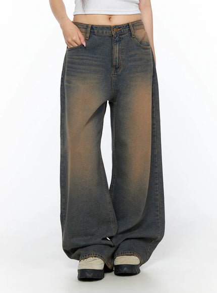Neya Dark Washed Baggy Jeans CL517 Dark blue front shot on model waist-down hand in pocket showing heavy brown center gradient wash and ultra-wide leg opening