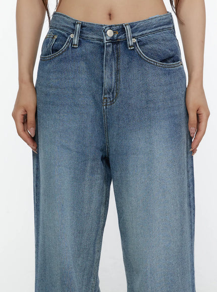 Nixi Wide Leg Jeans CL508 Blue close-up front detail on model showing waistband, front pockets, button fly, and washed denim fabric texture