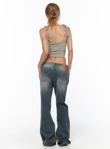 Noel Washed Bootcut Jeans CU524 Blue full back view on model in gray cami showing silver stud-embellished waistband leather logo patch and flared hem