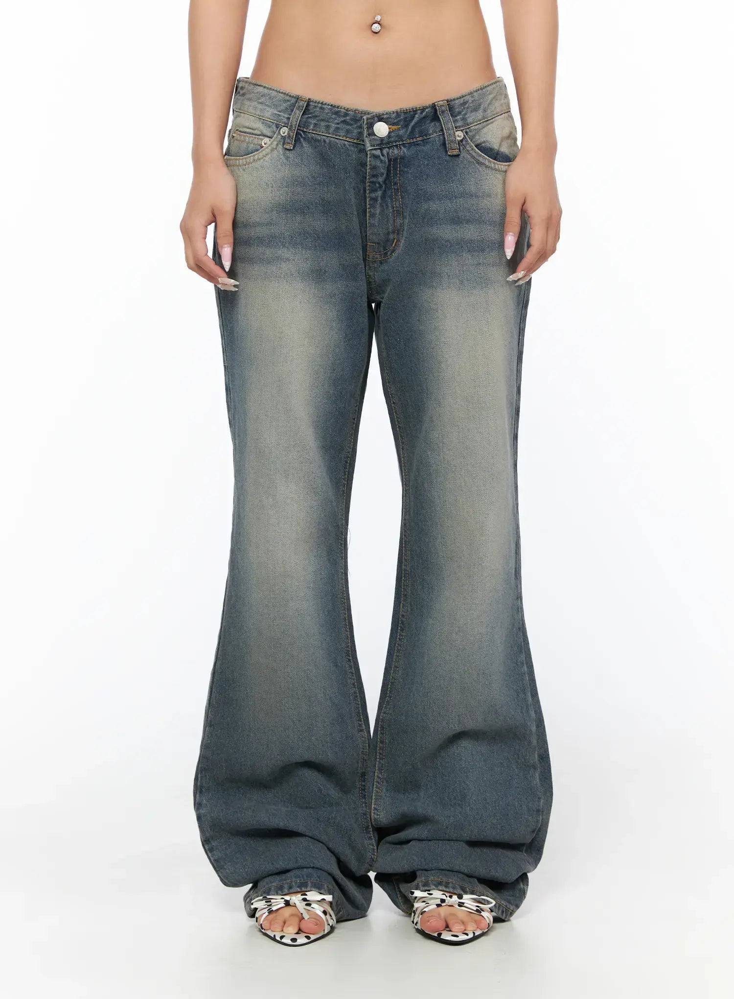 Noel Washed Bootcut Jeans CU524 Blue front close-up on model showing V-shaped low waist button closure faded wash denim and flare hem