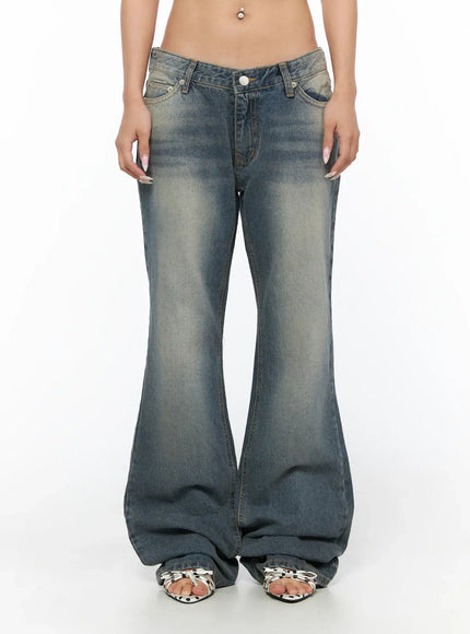 Noel Washed Bootcut Jeans CU524 Blue front close-up on model showing V-shaped low waist button closure faded wash denim and flare hem