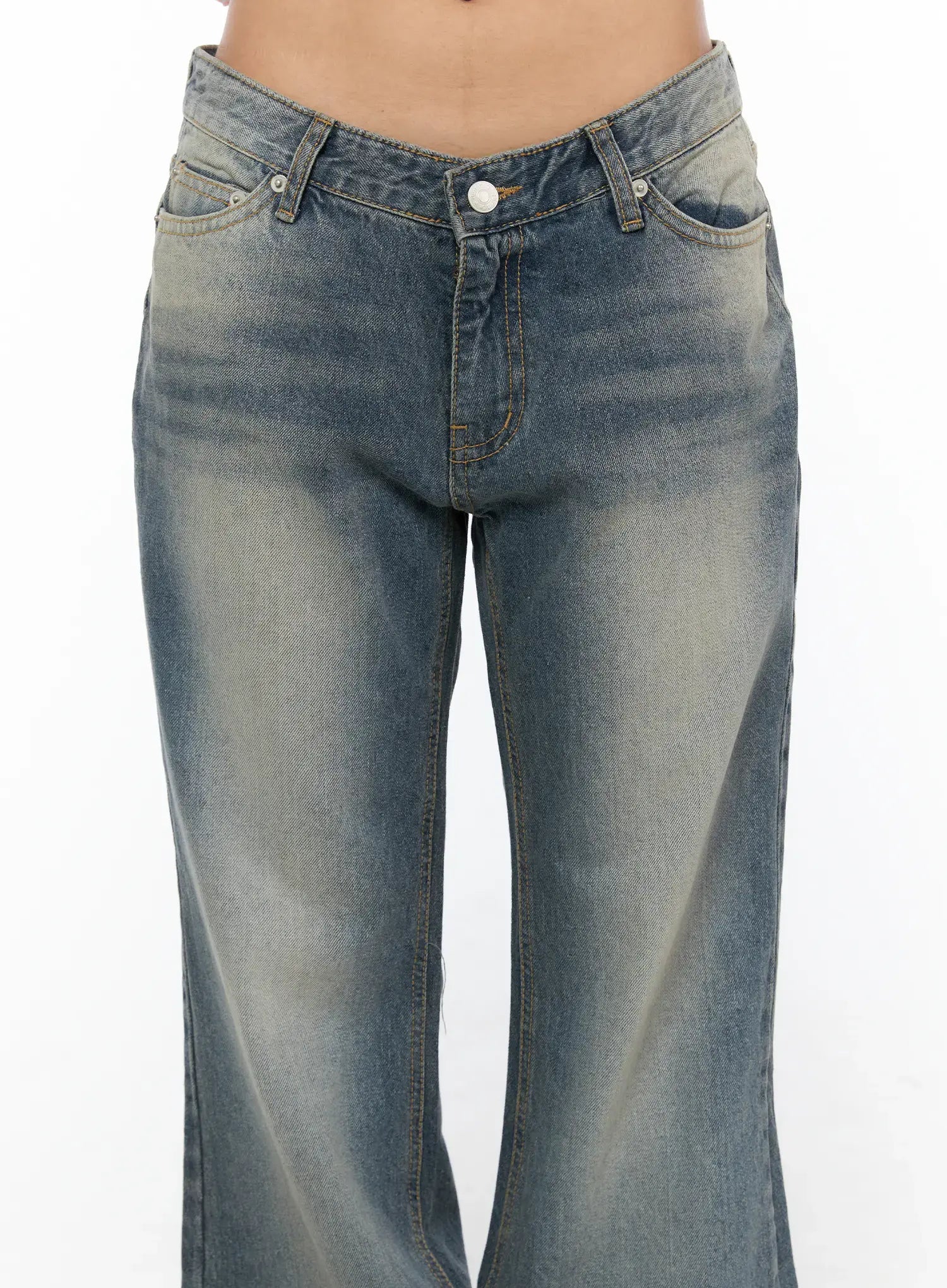 Noel Washed Bootcut Jeans CU524 Blue close-up front detail of V-shaped low-rise waistband button fly side pockets and faded wash denim texture