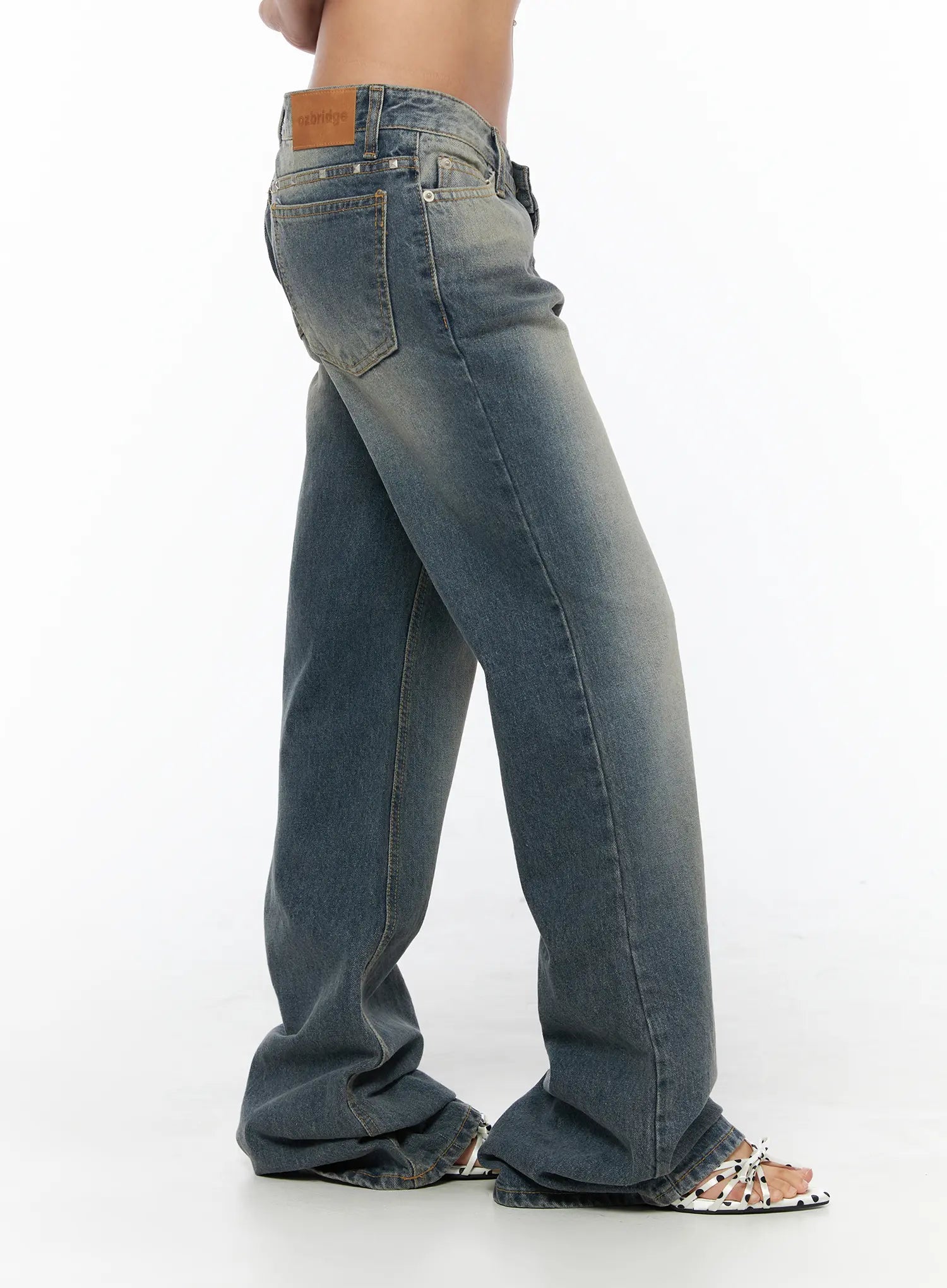 Noel Washed Bootcut Jeans CU524 Blue side shot on model showing wide-leg bootcut silhouette leather patch label and faded wash texture