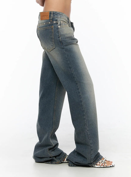 Noel Washed Bootcut Jeans CU524 Blue side shot on model showing wide-leg bootcut silhouette leather patch label and faded wash texture