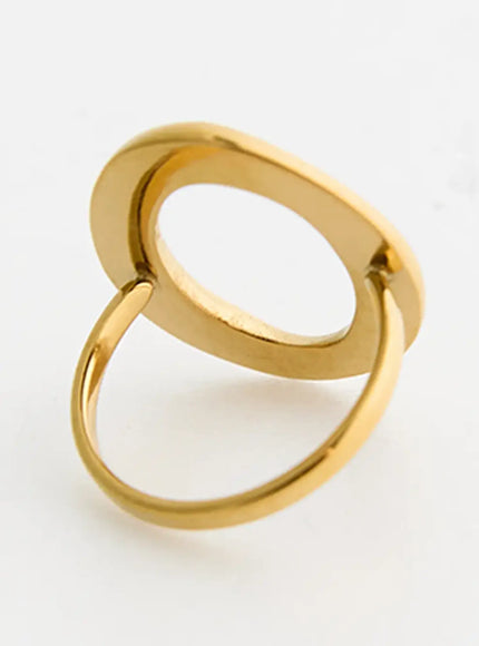 Nova O Ring IL517 Gold back-angle detail shot revealing inner oval frame construction and open band underside, polished gold-tone metal