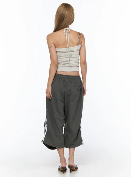 Nylon Track Bermuda Pants CU523 Dark gray back full-body shot on model showing rear view of wide leg silhouette white side stripes and back pocket