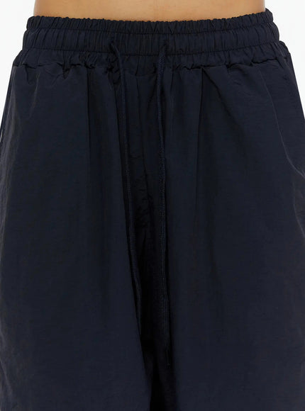 Nylon Wide-Leg Shorts IL524 Dark blue close-up detail of elasticated waistband with navy drawstring cord and gathered nylon fabric texture