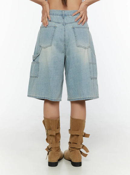 Nyra Low-Rise Jorts CU529 Light blue back shot on model from waist down showing large back patch pockets and faded wash with suede boots