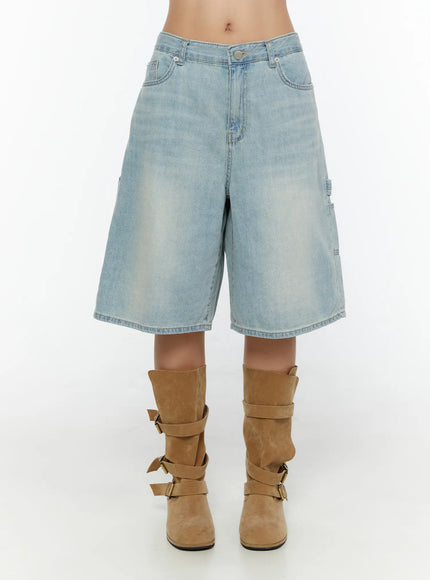 Nyra Low-Rise Jorts CU529 Light blue front shot on model cropped at waist showing button fly five-pocket construction and wide-leg washed denim silhouette