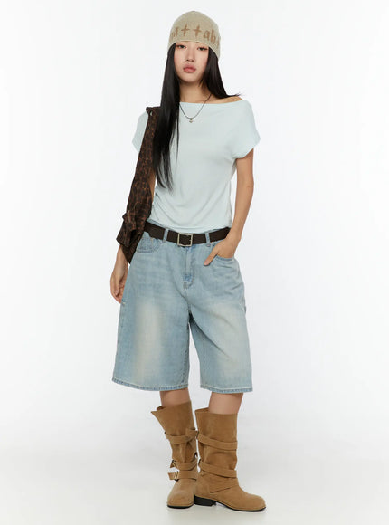 Nyra Low-Rise Jorts CU529 Light blue full-body front shot on model styled with mint off-shoulder top beanie belt and brown buckle boots