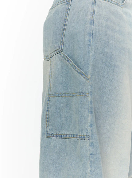 Nyra Low-Rise Jorts CU529 Light blue close-up detail of left-side front cargo pocket with angled stitching and washed light blue denim texture