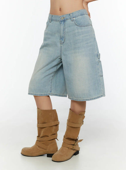LEWKIN Nyra Low-Rise Jorts CU529 Light blue side shot on model cropped at waist showing cargo pocket detail and faded denim texture with brown suede boots
