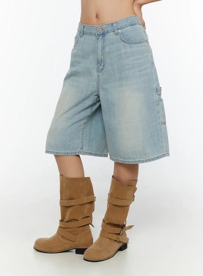 LEWKIN Nyra Low-Rise Jorts CU529 Light blue side shot on model cropped at waist showing cargo pocket detail and faded denim texture with brown suede boots