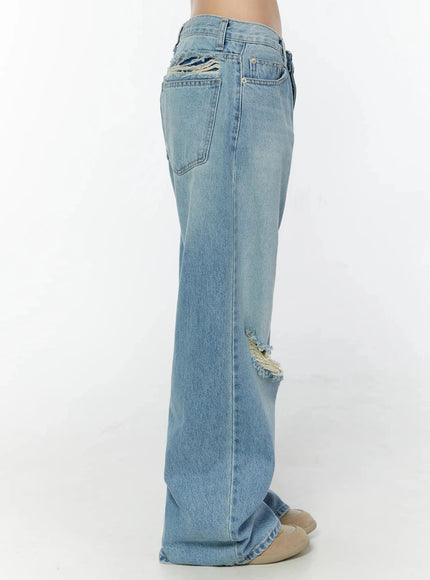 Odette Distressed Semi-Wide Jeans IU524 Blue side shot on model showing right-side view with rear pocket, upper back distressing detail and full-length wide leg
