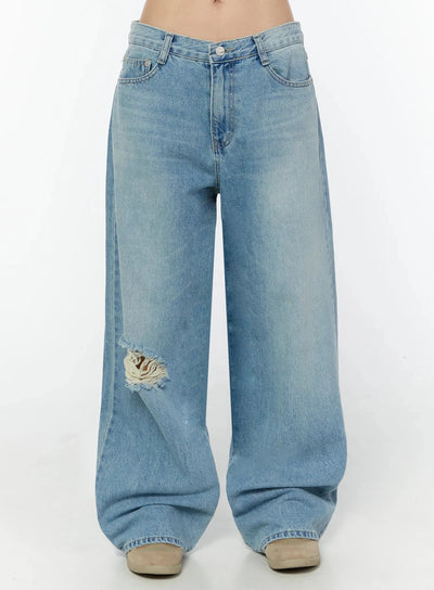 LEWKIN Odette Distressed Semi-Wide Jeans IU524 Blue Size S front close-up on model showing low-rise waistband, silver button, faded denim texture and frayed knee rip