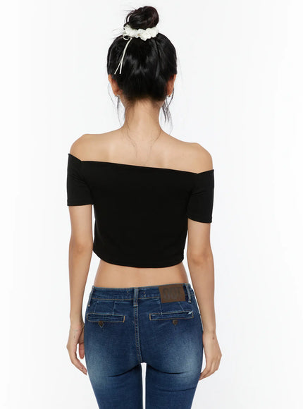 Off-Shoulder Crop Top CU529 Black close-up back model shot highlighting off-shoulder neckline structure and smooth ribbed fabric with cropped hemline