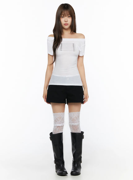 Off-Shoulder Crop Top IL523 White full-body front shot on model standing straight, off-shoulder neckline, slim semi-sheer knit, styled with black shorts lace socks and boots